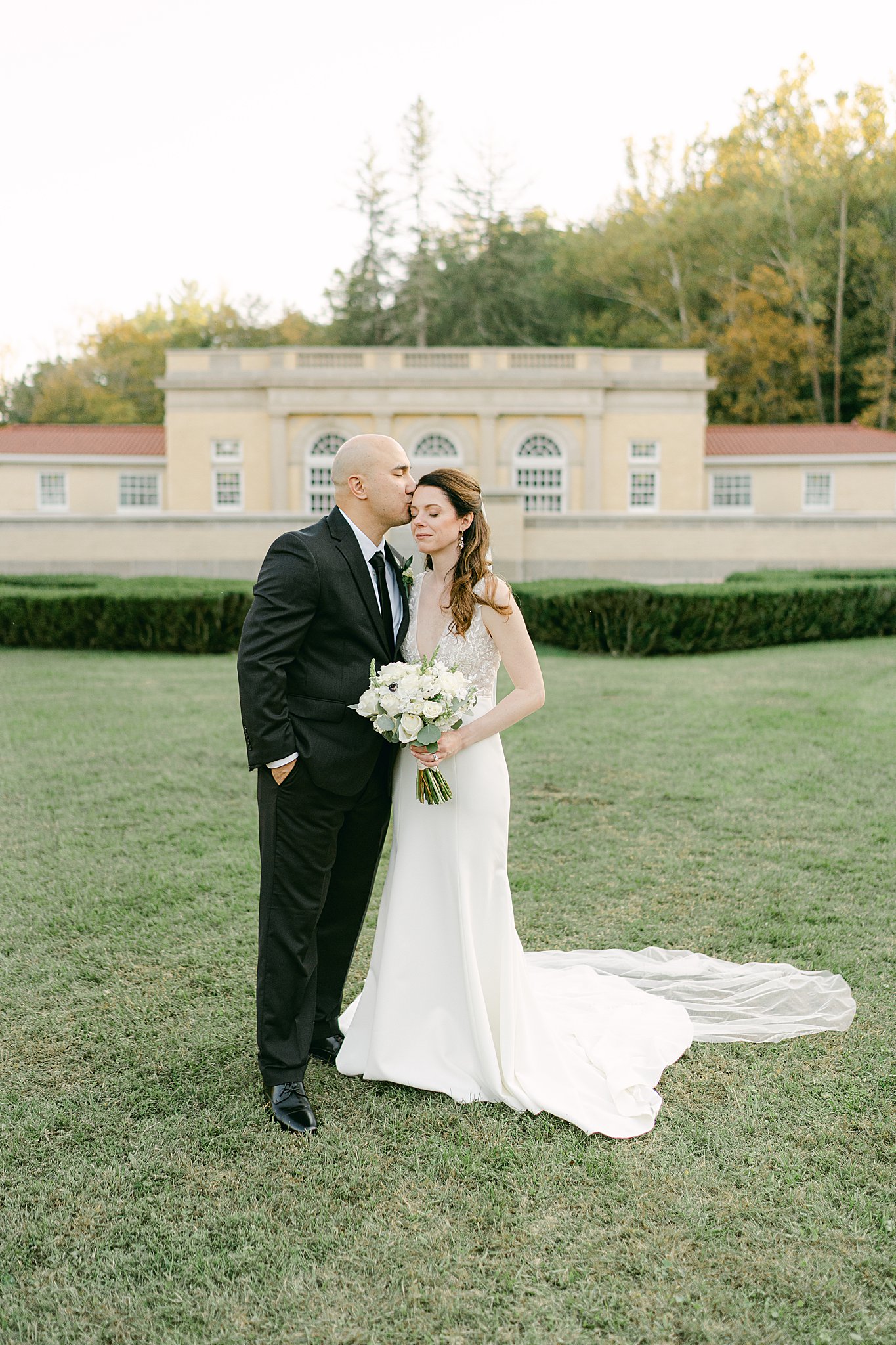 Bride and groom share a quiet moment in the gardens of West Baden Springs Hotel