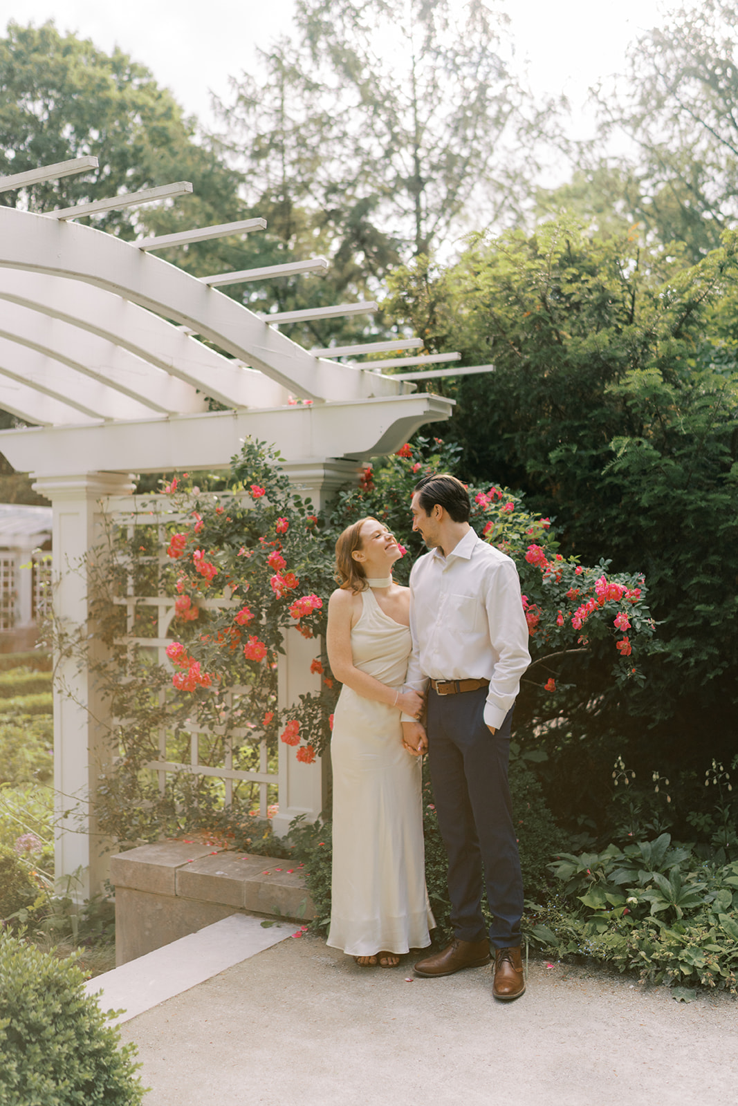 Couple with roses at Newfields engagement session in Indianapolis